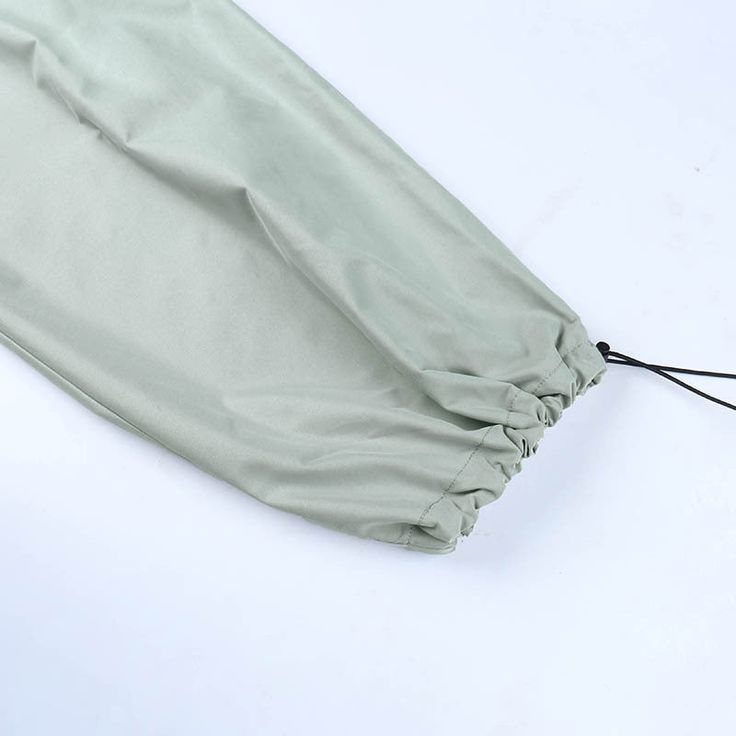 Product information : Main fabric composition: Polyester. Spandex Color: light green. black Style Type: Casual/Street/Vintage/Y2KComfortable Fit: The drawstring waist and flexible fit of these cargo parachute pants ensure that they are comfortable to wear for extended periods of time.Versatile Style: With their loose fit and utility pockets. these pants are perfect for a variety of activities. from hiking and camping to running errands around town.Unique Design: The gathered detailing at the leg and pig nose buttons give these pants a unique and stylish look that sets them apart from other cargo pants on the market.High-Quality Materials: Made from durable materials. these pants are built to last and can withstand the wear and tear of everyday use.Practical Features: The utility pockets on Green Drawstring Bottoms For Outdoor, Green Outdoor Bottoms With Drawstring, Outdoor Green Drawstring Bottoms, Green Cotton Parachute Pants With Drawstring, Green Drawstring Bottoms For Outdoor Activities, Green Stretch Cargo Pants For Outdoor Activities, Green Stretch Parachute Pants For Outdoor, Stretch Green Cargo Pants For Outdoor Activities, Green Stretch Cargo Pants For Outdoor