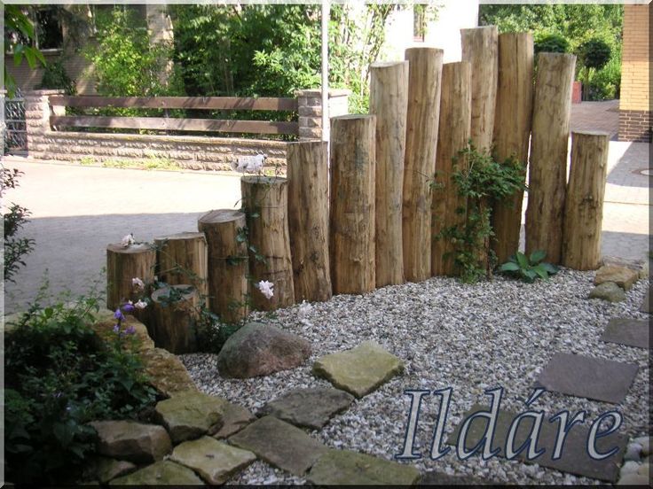 a small garden area with rocks and gravel