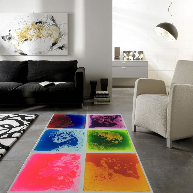 a living room filled with furniture and colorful rugs