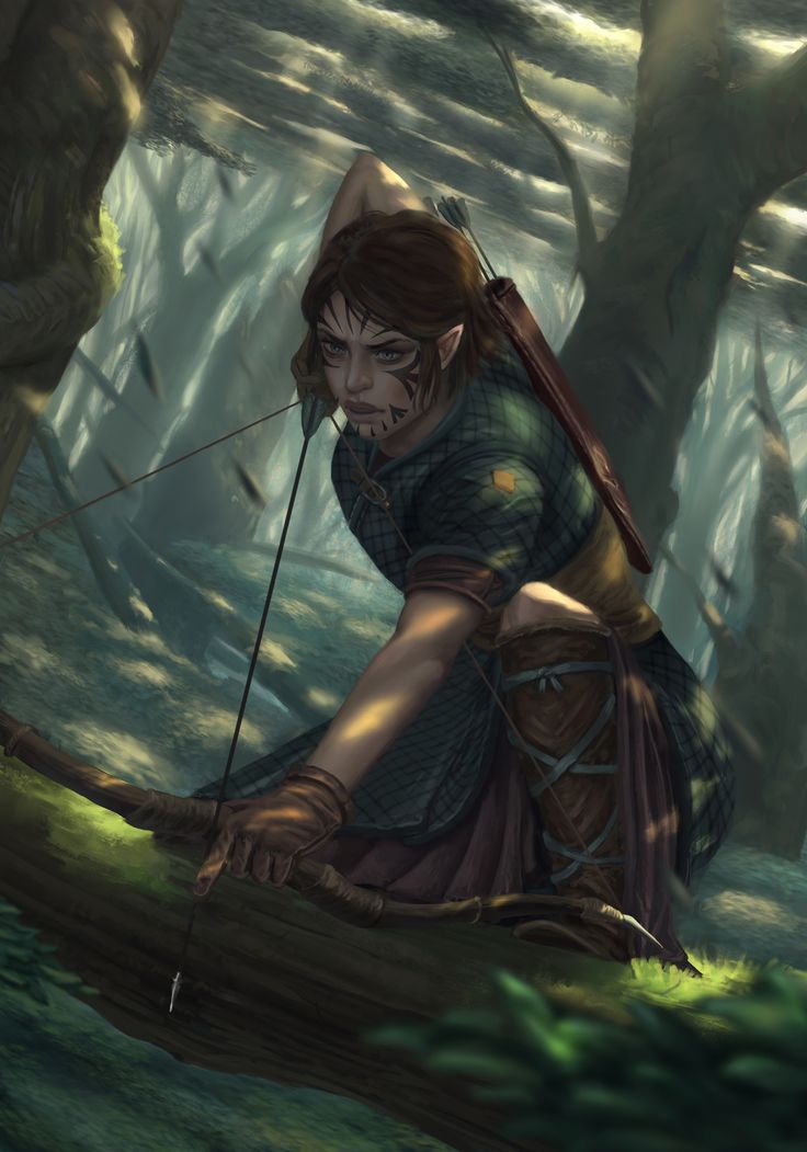 a woman kneeling down in the woods with a bow on her head and arrows in her hand