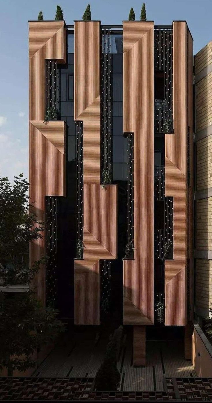 the building is made out of wood and has many vertically spaced sections on each side