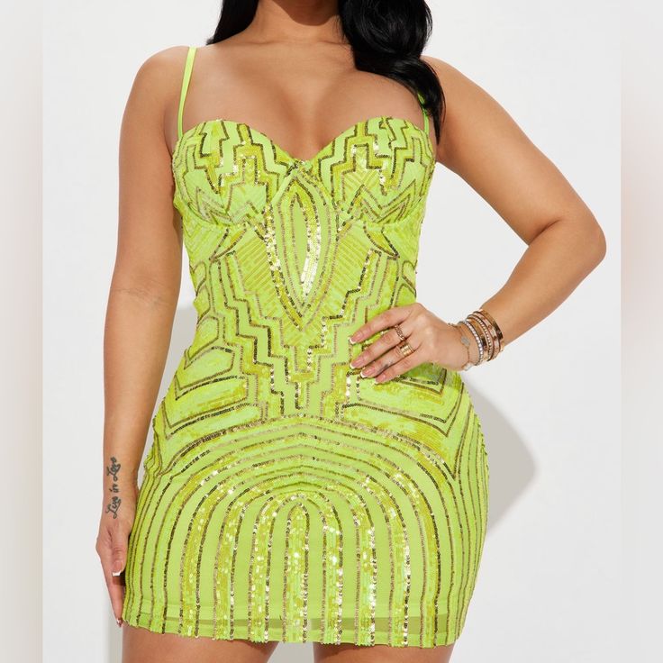 a woman in a short neon green dress