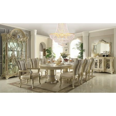 a dining room table with chairs and a chandelier