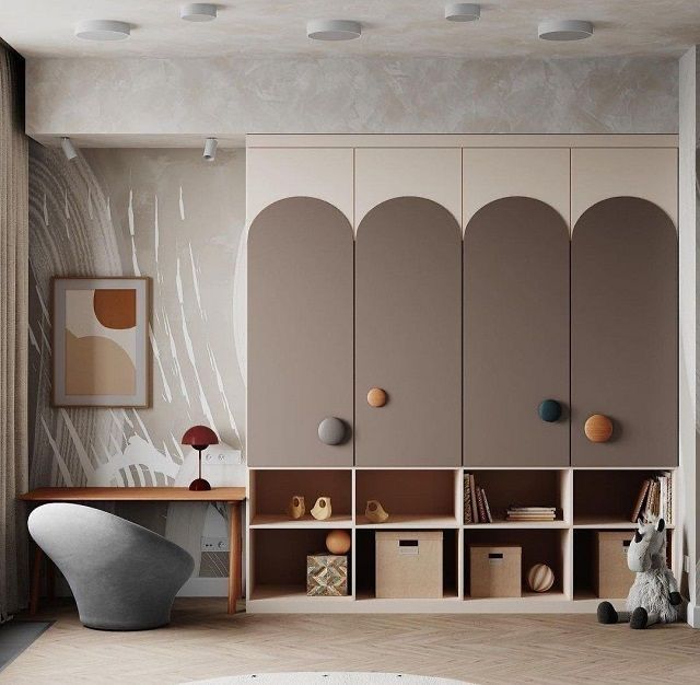 a living room filled with lots of furniture next to a wall mounted bookcases