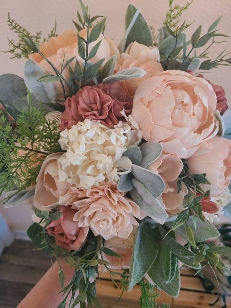 a bouquet of flowers sitting on top of a table