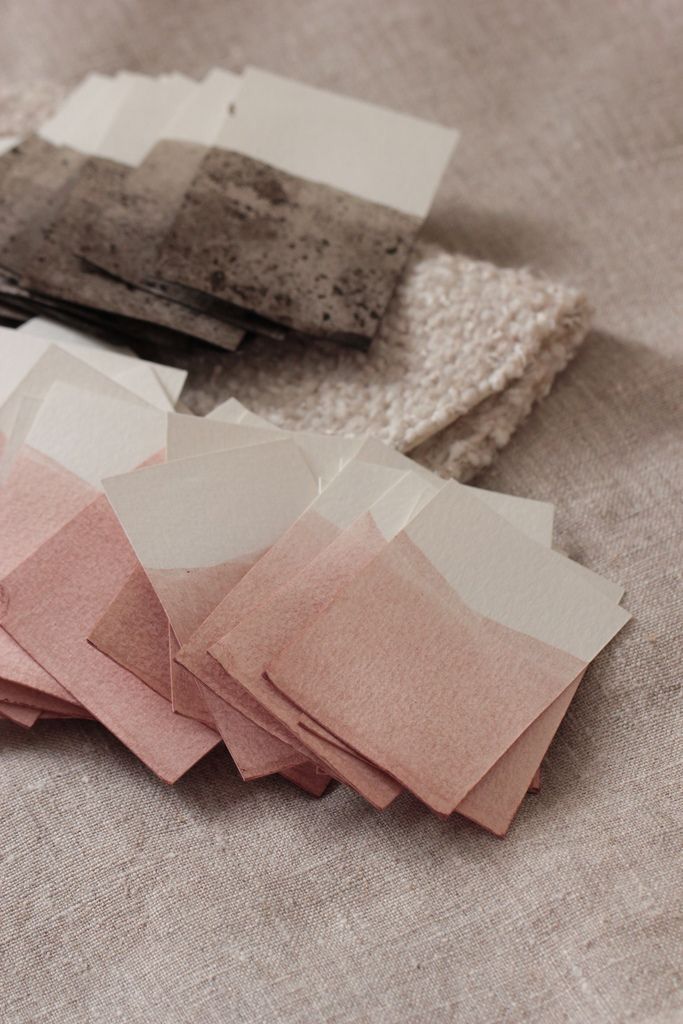 several different shades of fabric on top of each other, including pink and greys