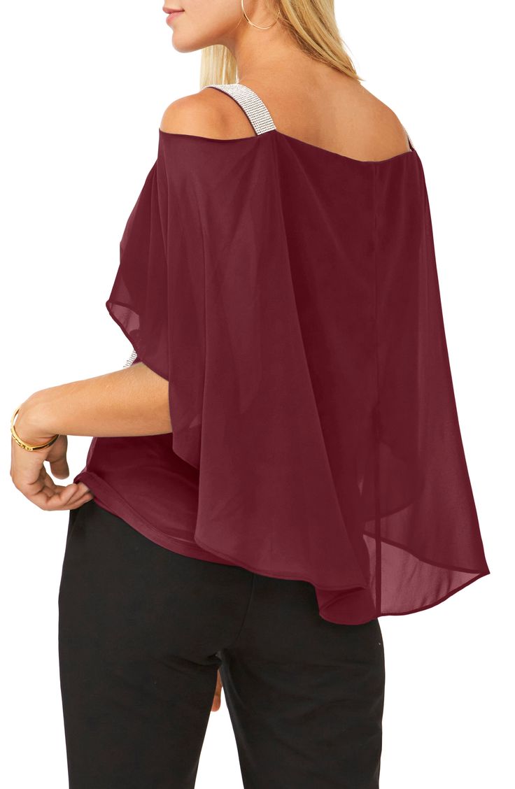 Pop on this light and airy off-the-shoulder top that showcases a sheer cape overlay at the back and glittering rhinestones at the shoulders and side. 95% polyester, 5% spandex Hand wash, line dry Imported Off-shoulder Chiffon Blouse For Party, Elegant Off-shoulder Chiffon Tops, Off-shoulder Chiffon Party Tops, Flowy Summer Evening Blouse, Off-shoulder Chiffon Blouse, Summer Off-shoulder Mesh Top For Night Out, Chiffon Top With Sheer Sleeves For Night Out, Flowy Chiffon Tops For Night Out, Loose Fit Chiffon Top For Night Out