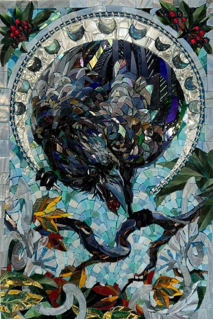 a mosaic art work depicting a tree surrounded by leaves