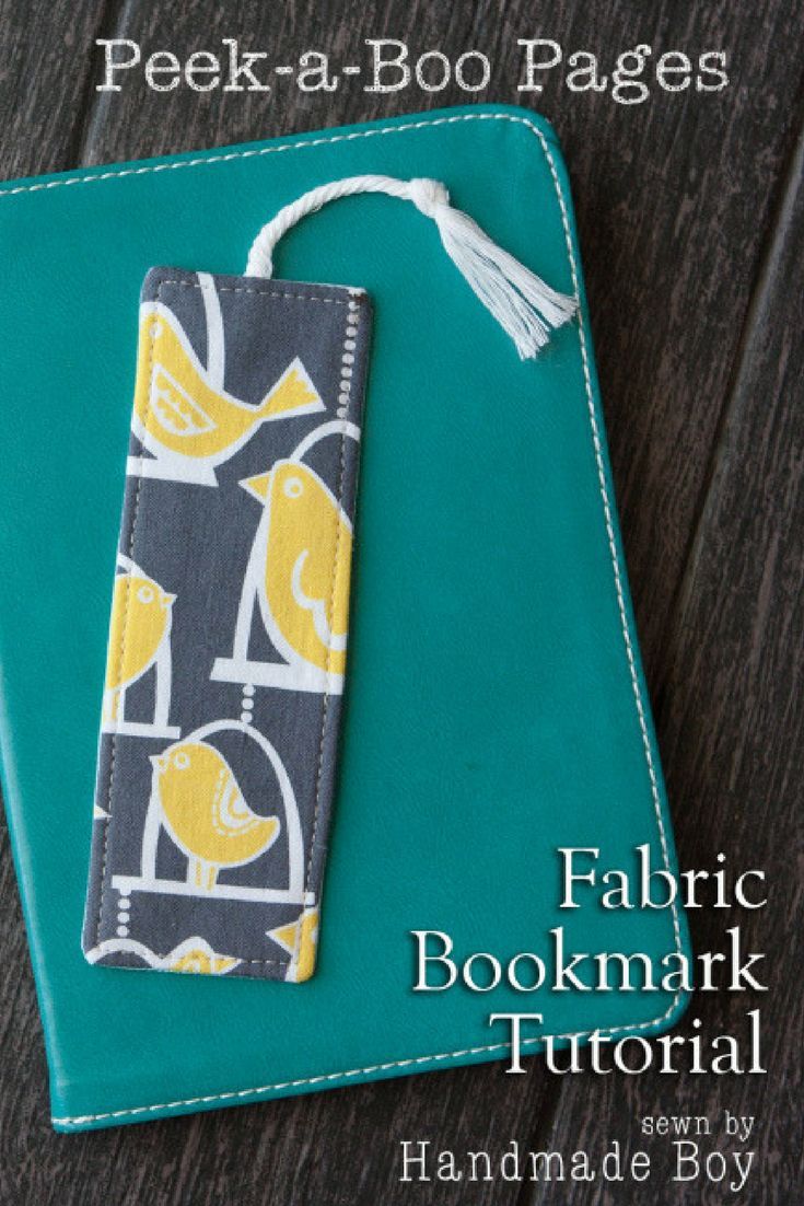 a bookmark made out of fabric on top of a wooden table with text overlay that reads peek - a - boo pages