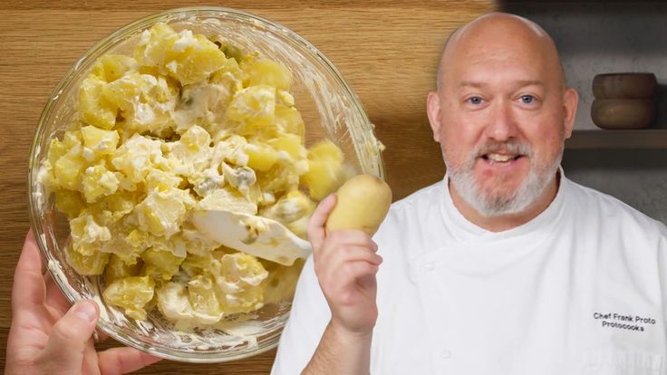 a man is holding a potato in front of a bowl full of potatoes and eggs