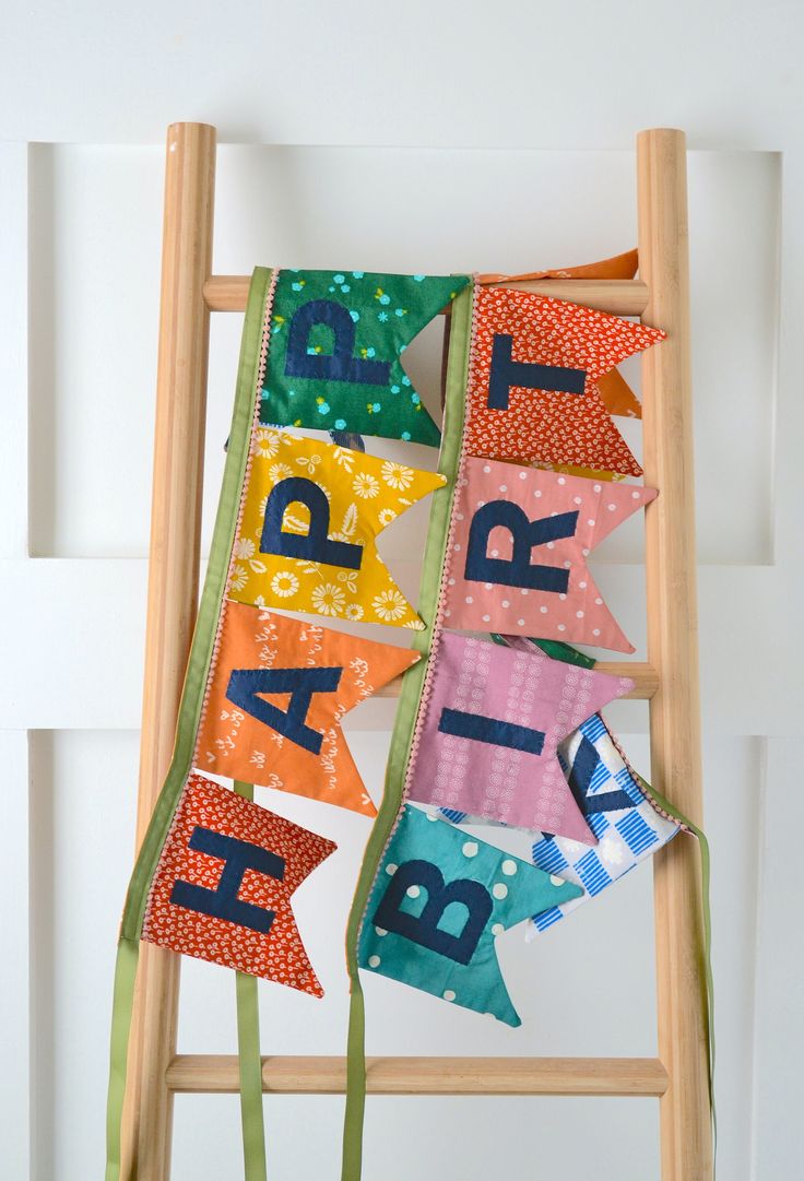 a ladder decorated with happy birthday banners