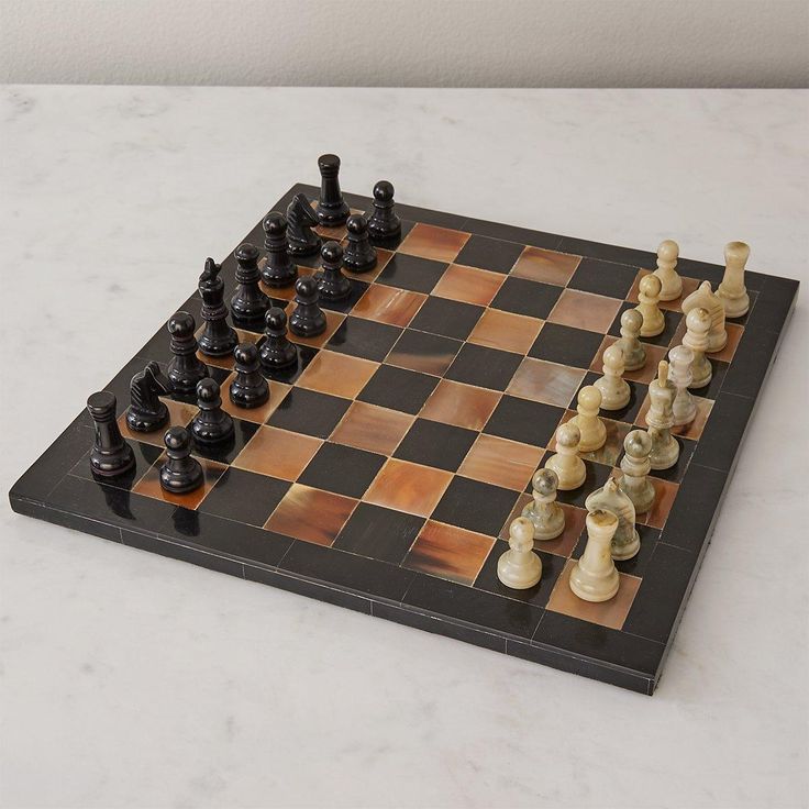 a chess board with several pieces on it