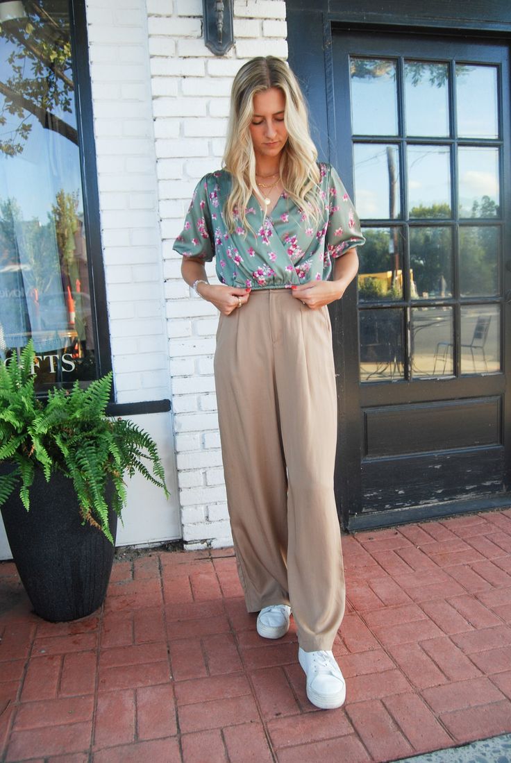 Get ready to up your fashion game with the Dress Code Trouser Pant! This tan pant features a comfortable elastic waistband and invisible zipper closure. Dress it up or down, these pants are perfect for any occasion. Say goodbye to uncomfortable trousers and hello to style and comfort! Khaki Pants With Elastic Waistband For Day Out, Brown Pants For Spring Day Out, Neutral Pants With Elastic Waistband For Day Out, Spring Business Casual Khaki Bottoms, Spring Khaki Bottoms For Business Casual, Chic Khaki Pants With Elastic Waistband, Business Casual Beige Pants With Elastic Waistband, Beige Pants With Elastic Waistband For Business Casual, Chic Taupe Pants For Spring