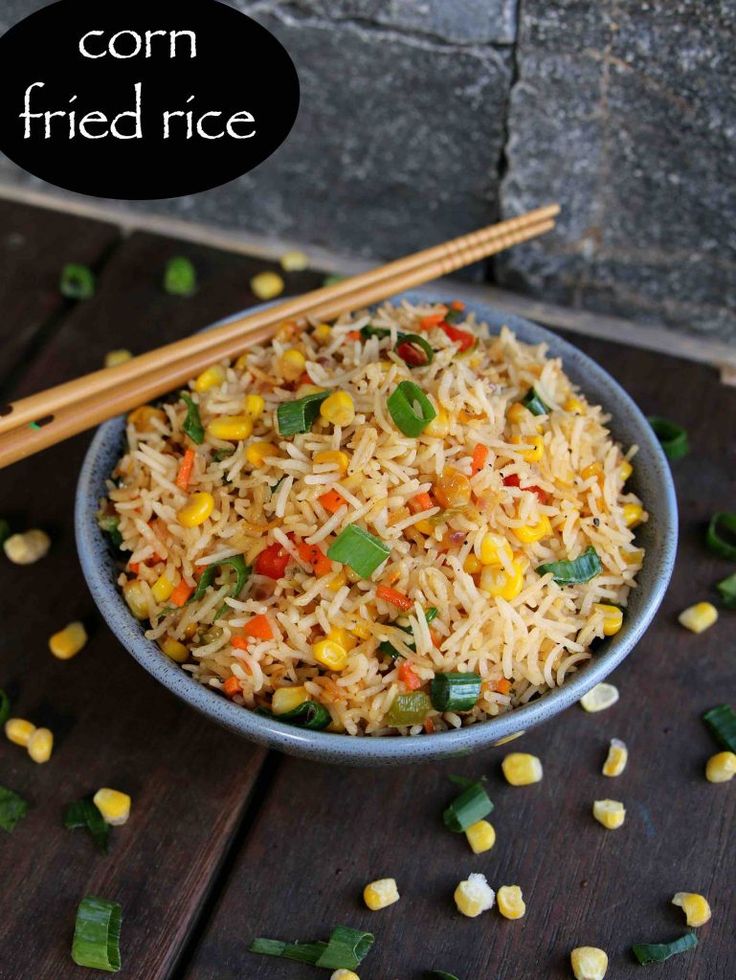 corn fried rice in a bowl with chopsticks