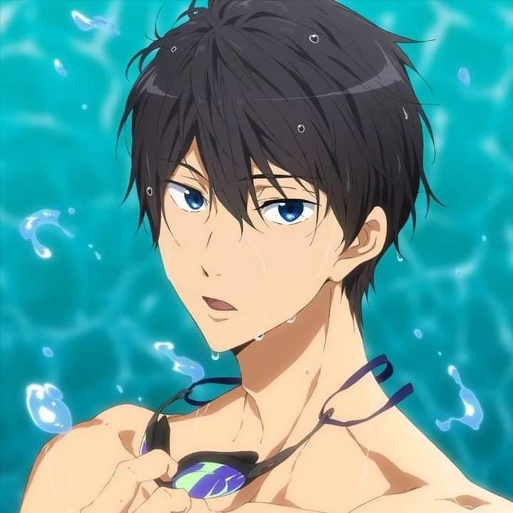 a young man with black hair and blue eyes wearing a swim suit in the water