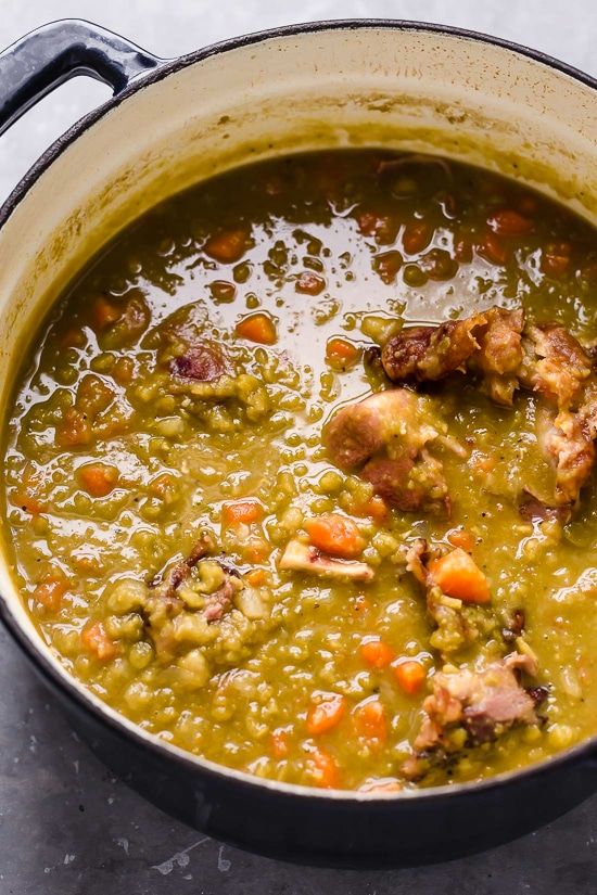 a pot full of soup with meat and vegetables