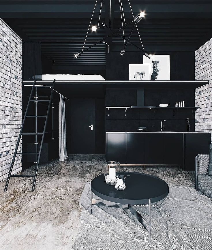 a black and white photo of a living room with ladders hanging from the ceiling