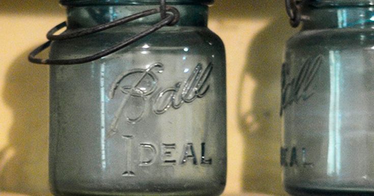 two blue mason jars sitting next to each other on a shelf with the words deal written on them