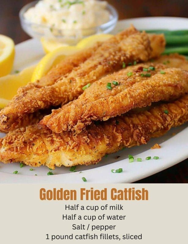 the golden fried catfish is served on a white plate with asparagus and lemon wedges