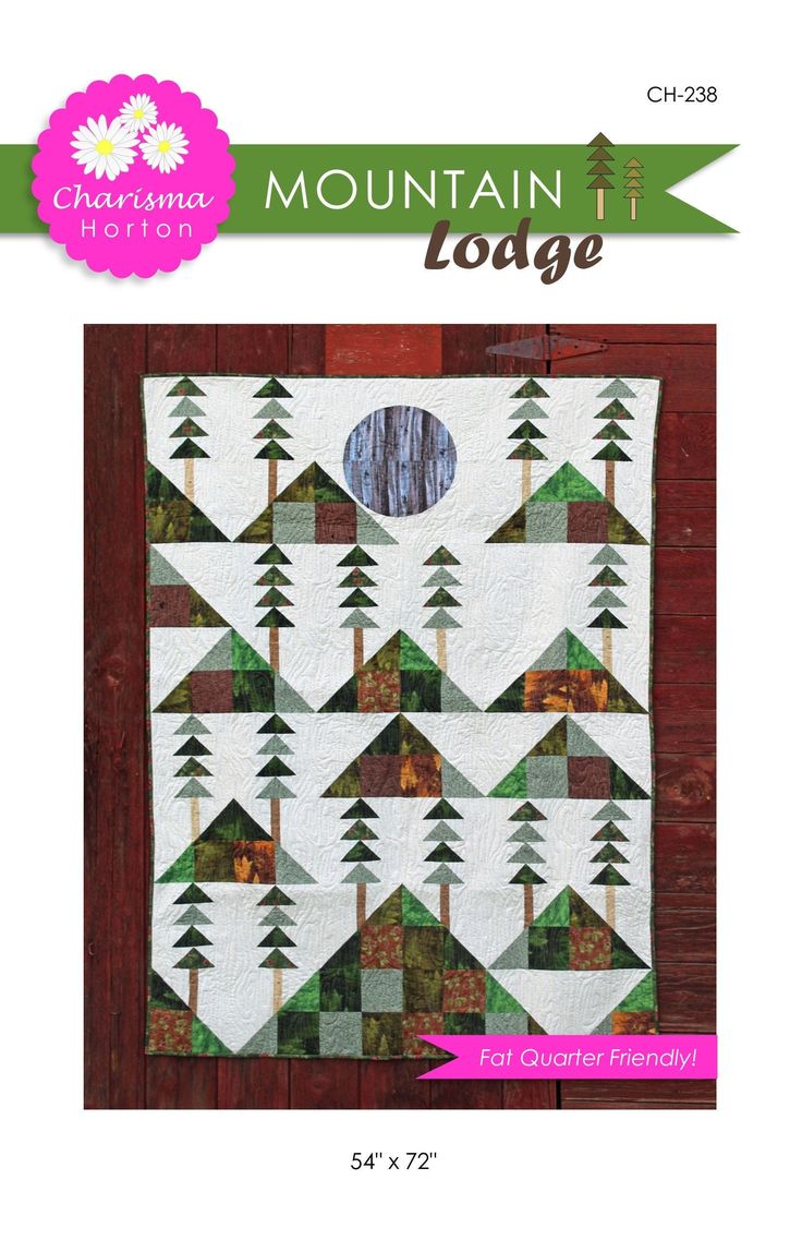 the mountain lodge quilt pattern is shown in front of a wooden background with an arrow on it