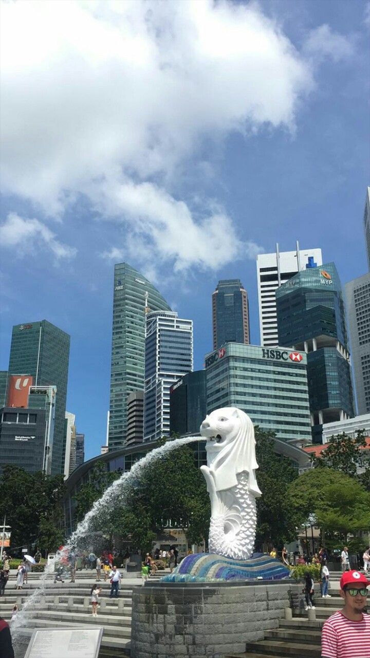 the water spouting from the statue is spraying up people