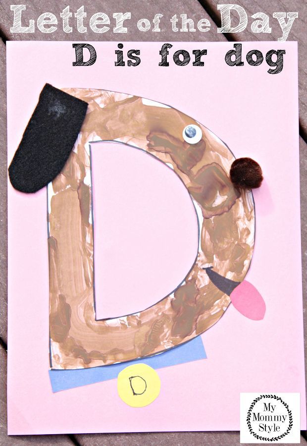 a letter of the day d is for dog made with construction paper and glue on a pink background