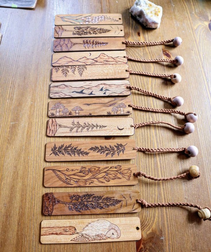 several wooden tags are lined up on a table