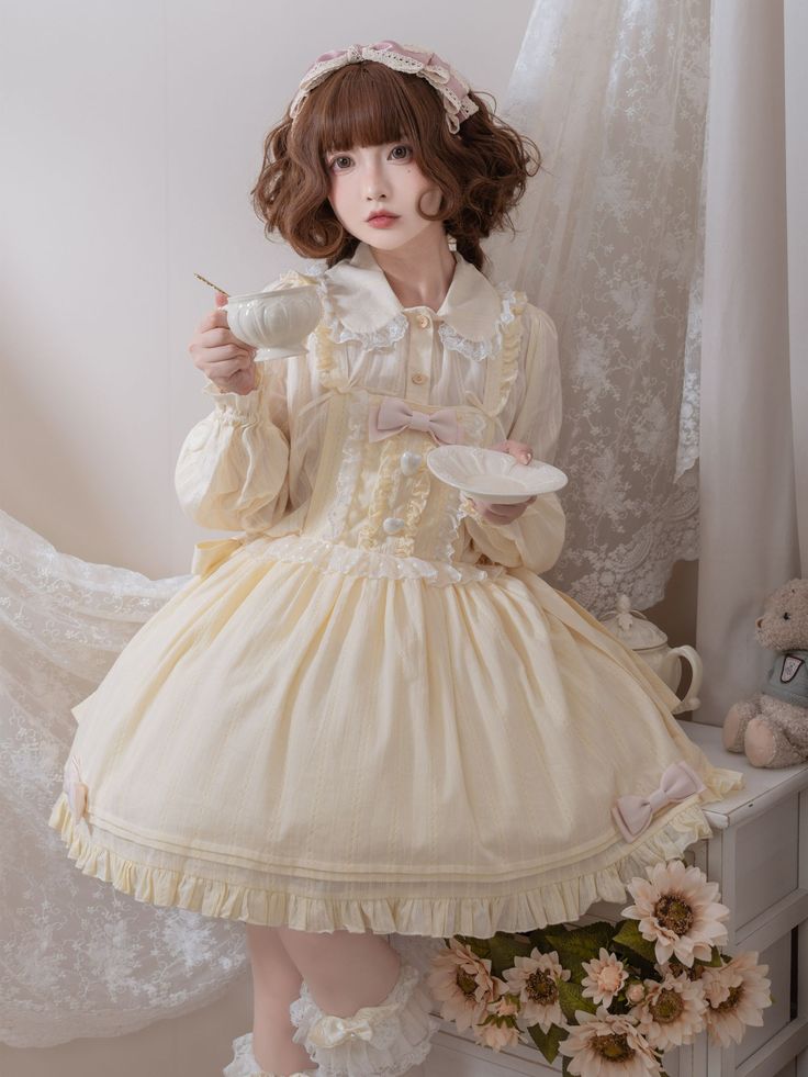 This price is for the overall dress only. Dress / Top Details:Big Bow / Bowknot Details / Lace Trim / Ruffle TrimDress Waistline:Natural WaistSkirt Details:Ruffle Hem  	 		 			Size 			S 			L 		 		 			Waist 			62-72 			72-82 		 		 			Full Length 			80 			82 Yellow Long Sleeve Ruffled Dress, Cute Cream Dress With Doll Collar, Sweet Long Sleeve Mini Dress For Spring, Yellow Sweet Dress With Ruffles, Sweet Cream Dresses With Ruffles, Big Bow, Sweet Lolita, Big Bows, Dress Top