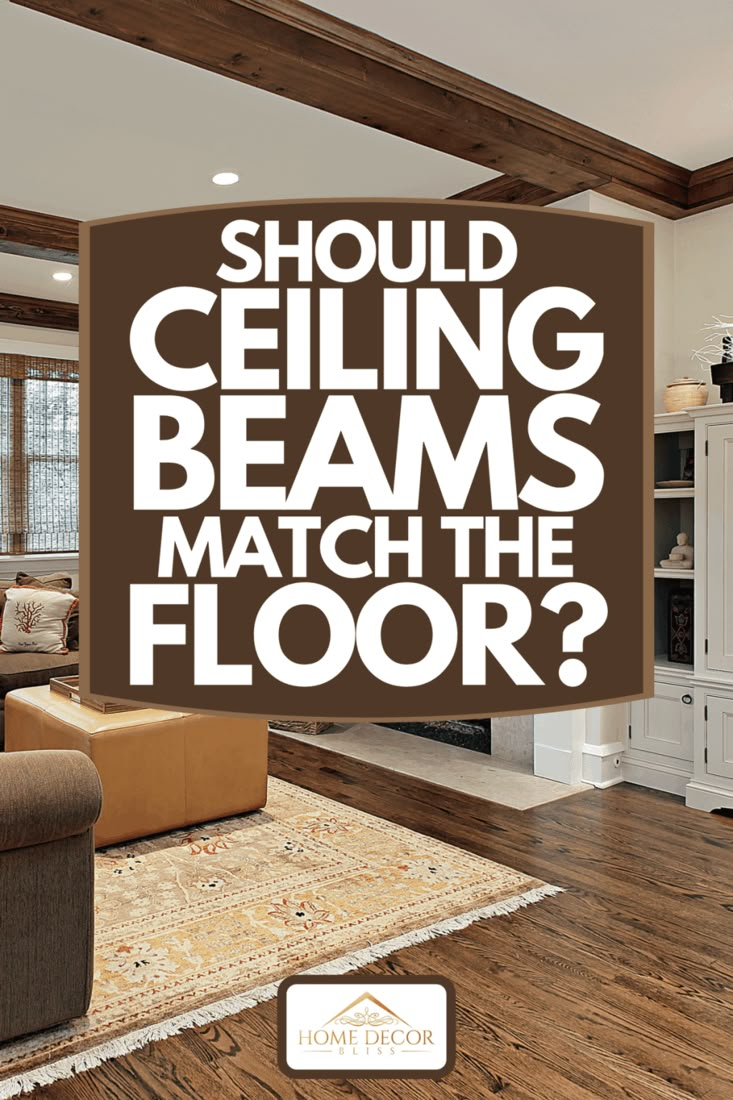 a living room filled with furniture and a sign that reads should ceiling ceilings beams match the floor?