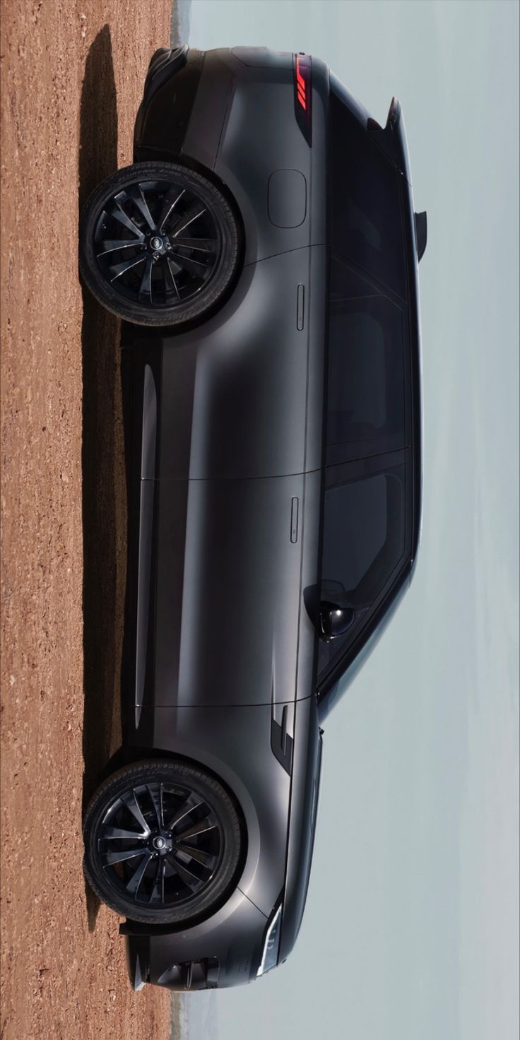 the top view of a black car parked on dirt