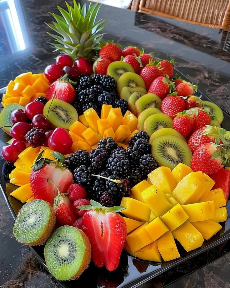 a platter filled with lots of different types of fruit