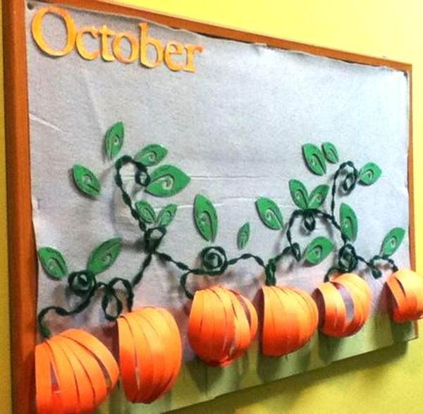 a bulletin board with pumpkins on it and the word october written in large letters