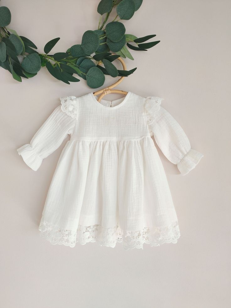 ♡ This is handmade and unique girl dress below knee-length and with long sleeves.  It is breathable, natural, comfortable to wear on special occasions. ♡ MADE OF: Ecru double gaze muslin with ecru lace (it's pure 100% ECO Organic Cotton) and wooden button. ♡ Processing time: ready to ship.  ♡ CARE INSTRUCTIONS: Wash in cold or warm water (30oC/ 65 - 85F). Do not use bleach. Dry at low temperatures, do not use machine drying. Iron at medium or low temperature. Hand wash and hang dry for longer we Cream Ruffled Lace Dress For Baptism, Cream Lace Ruffle Dress For Baptism, Spring First Communion Dress With Lace Patchwork, First Communion Lace Patchwork Dress For Spring, First Communion Spring Dress With Lace Patchwork, Cream Lace Dress For Summer Baptism, Cream Ruffled Dress For Baptism, White Ruffled Lace Dress For First Communion, First Communion Spring Dress With Lace Trim