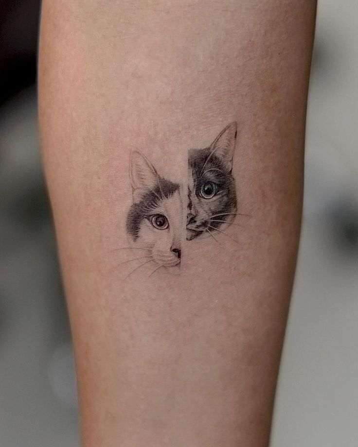 a cat and kitten's face on the leg, which is drawn in black ink