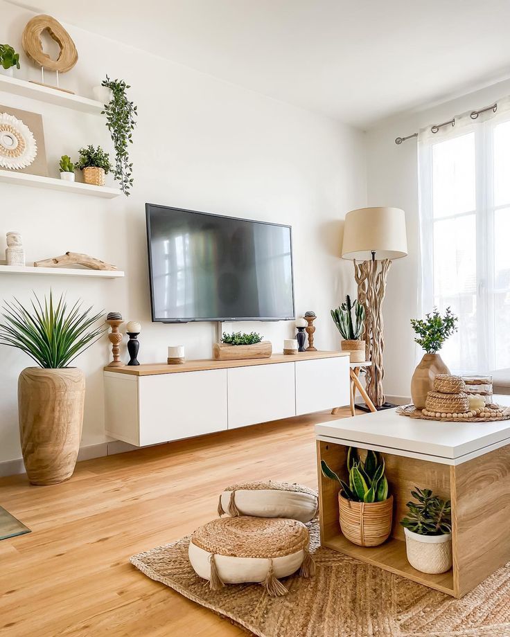 a living room filled with furniture and a flat screen tv