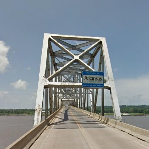 an old bridge with a blue sign on it's side that says ancients