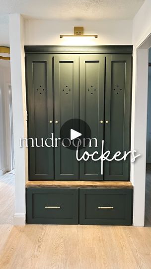 an empty room with green cabinets and wood floors