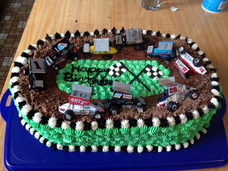 a birthday cake with cars and trucks on it