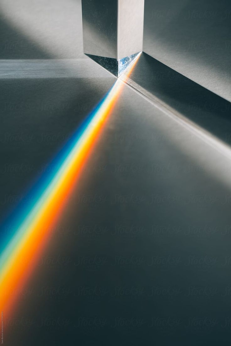 an image of a rainbow beam coming out of a box with the light shining through it