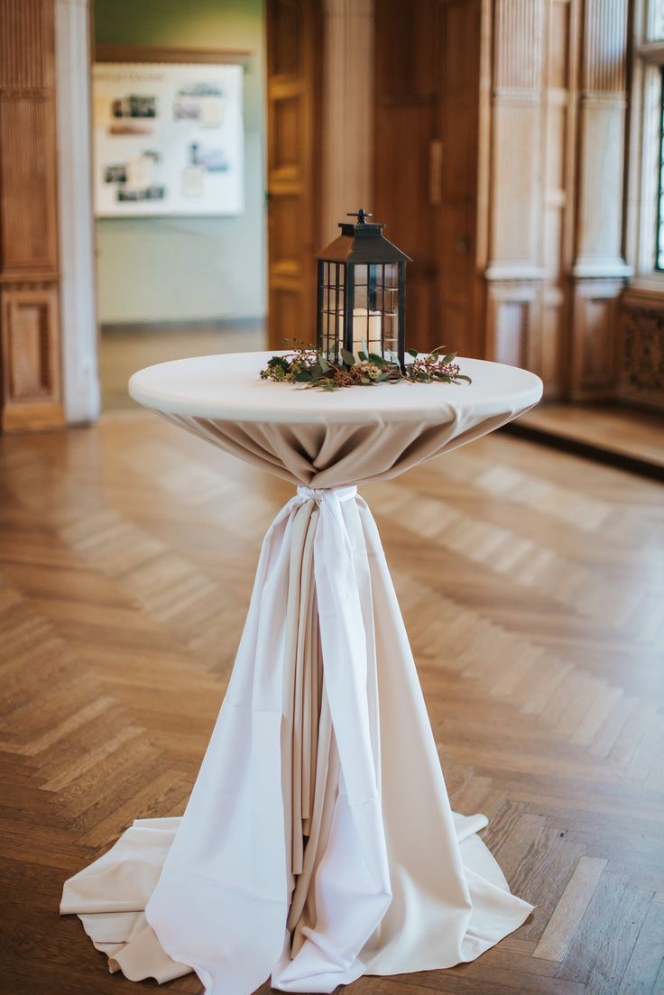 a small table with a lantern on top