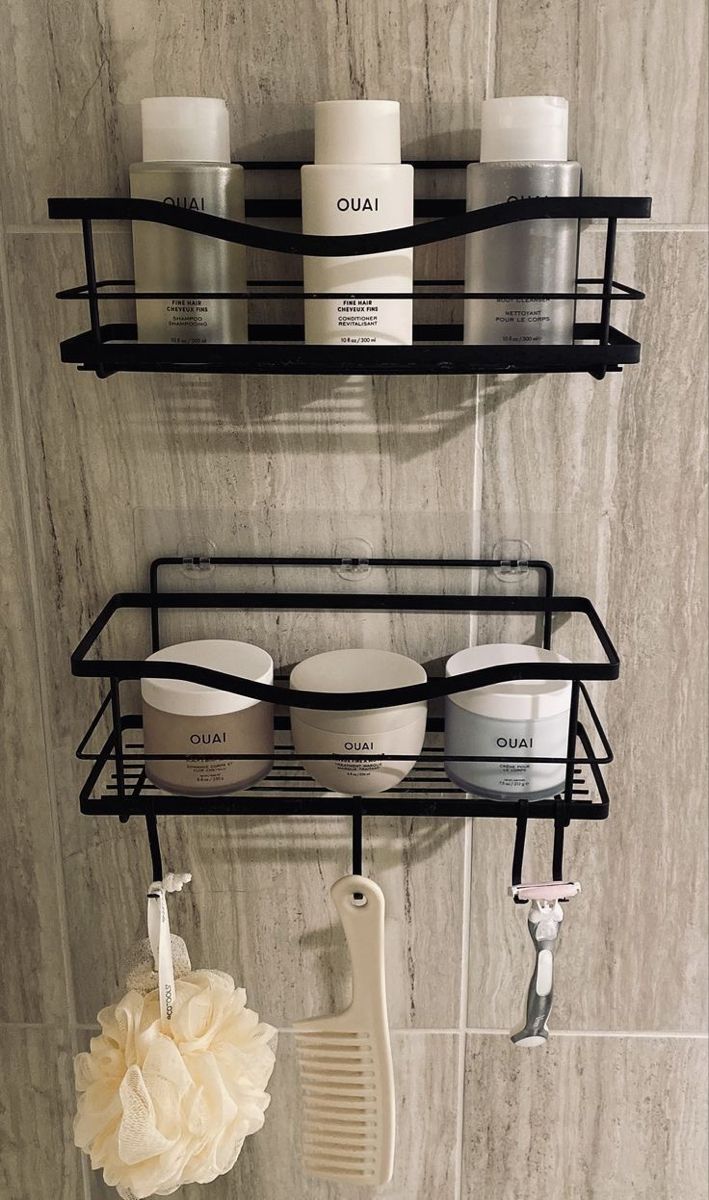 two shelves with hair products on them in a bathroom