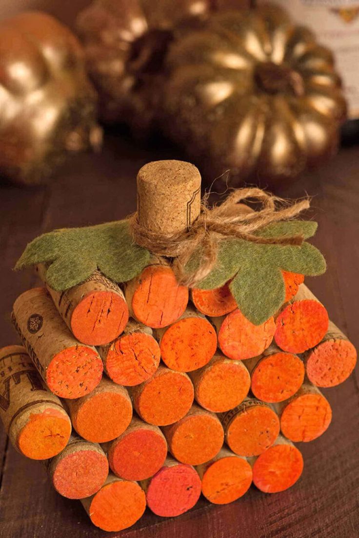 a wine cork pumpkin decoration on a table