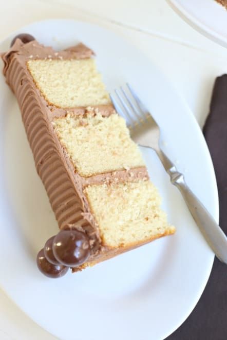 there is a piece of cake on the plate with a fork and knife next to it