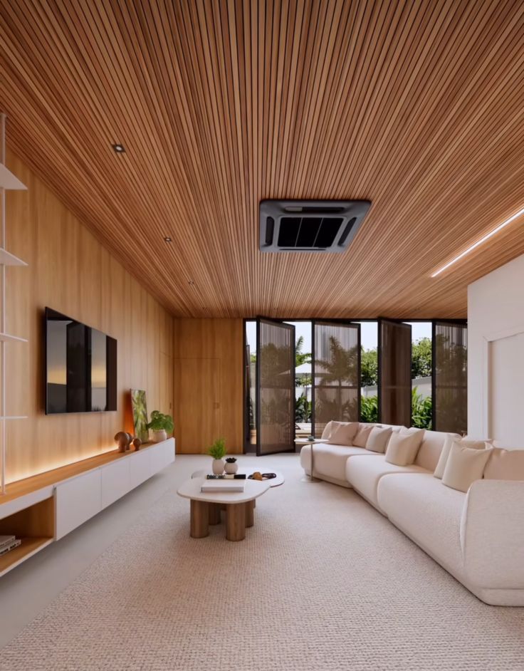 a living room filled with furniture and a flat screen tv