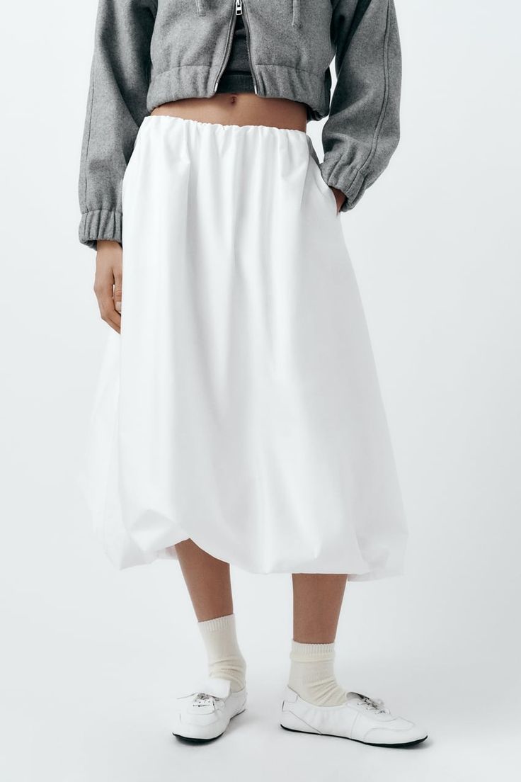 VOLUMINOUS MIDI SKIRT - White | ZARA United States Summer Asymmetrical Skirt With Pleated Hem, Asymmetrical Skirt With Pleated Hem For Summer, Asymmetrical Skirt With Pleated Hem For Spring, Spring Daywear Long Skirt, Casual Cotton Gathered Skirt, White Cotton Pleated Maxi Skirt, Fitted Cotton Bottoms With Gathered Skirt, Spring Daywear Lined Skirt Bottoms, Pleated Skirt Bottoms For Daywear