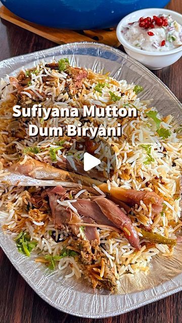 an image of a plate of food with rice and meats on the side that says sufynan mutton dum biyan