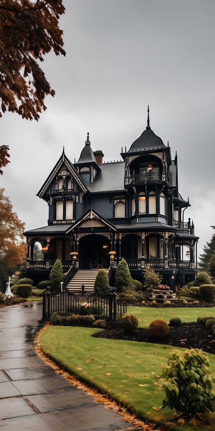 an old victorian style house in the rain