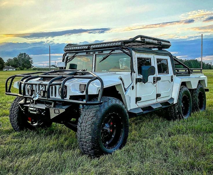 an off - road vehicle is parked in the grass