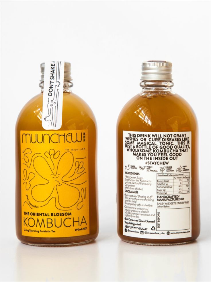 two bottles of kombucha on a white background