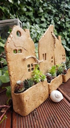 an outdoor planter with succulents and plants in it on a wooden table